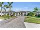 Beautiful home with a paver driveway and lush landscaping at 17745 Lucaya Dr, Lakewood Ranch, FL 34202