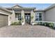 Inviting entryway with double doors and manicured landscaping at 17745 Lucaya Dr, Lakewood Ranch, FL 34202