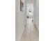 Clean hallway with tile flooring leading to a luxurious bathroom at 17745 Lucaya Dr, Lakewood Ranch, FL 34202