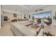 Spacious living room with large sectional sofa and access to the pool at 17745 Lucaya Dr, Lakewood Ranch, FL 34202