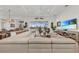 Open concept living room with a large sectional sofa and a view to the pool at 17745 Lucaya Dr, Lakewood Ranch, FL 34202