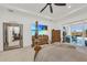 Bright bedroom with a large TV, king-size bed, and plenty of natural light at 17745 Lucaya Dr, Lakewood Ranch, FL 34202