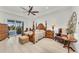 Spacious main bedroom with king-size bed, sitting area, and access to backyard at 17745 Lucaya Dr, Lakewood Ranch, FL 34202