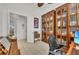 Bright office space with built-in shelving and a view to the living room at 17745 Lucaya Dr, Lakewood Ranch, FL 34202