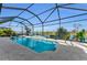 Relaxing pool area with a screened enclosure and water view at 17745 Lucaya Dr, Lakewood Ranch, FL 34202