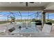 Relaxing pool area with screened patio and outdoor dining furniture at 17745 Lucaya Dr, Lakewood Ranch, FL 34202