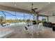 Inviting pool area with a screened patio, outdoor dining set, and lounge chairs at 17745 Lucaya Dr, Lakewood Ranch, FL 34202