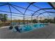 Beautiful screened pool at sunset, overlooking a serene lake view at 17745 Lucaya Dr, Lakewood Ranch, FL 34202