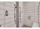 Large walk-in shower with dual shower heads and pebble tile accents at 17745 Lucaya Dr, Lakewood Ranch, FL 34202