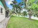 Landscaped backyard with pond view at 1216 Angela Maria Rd # 2, Sarasota, FL 34243