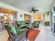 A beautiful lanai featuring wicker furniture and ceiling fan at 1216 Angela Maria Rd # 2, Sarasota, FL 34243