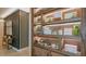 Built-in shelving with various items on display at 3118 Tramonto Ct, Bradenton, FL 34211