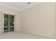 Living room with sliding doors to backyard access at 4417 Mcintosh Lake Ave, Sarasota, FL 34233