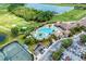 Resort-style pool and clubhouse with lush landscaping and golf course views at 323 Winding Brook Ln # 102, Bradenton, FL 34212