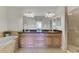 Double vanity bathroom with granite countertops at 323 Winding Brook Ln # 102, Bradenton, FL 34212
