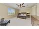 Bright bedroom with a king-size bed and large window at 323 Winding Brook Ln # 102, Bradenton, FL 34212