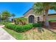 Elegant community center with stone facade and wrought iron gate at 323 Winding Brook Ln # 102, Bradenton, FL 34212
