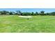 Green golf course with sand trap at 323 Winding Brook Ln # 102, Bradenton, FL 34212