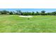 Picturesque golf course with lush green fairways and sand traps at 323 Winding Brook Ln # 102, Bradenton, FL 34212