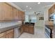 Modern kitchen with stainless steel appliances and wood cabinets at 323 Winding Brook Ln # 102, Bradenton, FL 34212