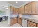 Modern kitchen with ample cabinetry and granite countertops at 323 Winding Brook Ln # 102, Bradenton, FL 34212