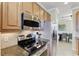 Well-equipped kitchen, featuring stainless steel appliances at 323 Winding Brook Ln # 102, Bradenton, FL 34212