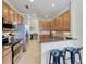 Spacious kitchen with stainless steel appliances and granite countertops at 323 Winding Brook Ln # 102, Bradenton, FL 34212