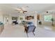 Open concept living area; sectional sofa, modern decor, access to kitchen at 323 Winding Brook Ln # 102, Bradenton, FL 34212