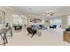 Spacious living room with large sectional sofa, neutral decor, high ceilings at 323 Winding Brook Ln # 102, Bradenton, FL 34212