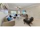 Open concept living area; sectional sofa, large TV, neutral decor at 323 Winding Brook Ln # 102, Bradenton, FL 34212