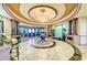 Elegant building lobby with high ceilings and seating at 323 Winding Brook Ln # 102, Bradenton, FL 34212