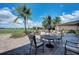 Community patio with seating and tables, overlooking a golf course at 323 Winding Brook Ln # 102, Bradenton, FL 34212