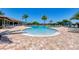 Relaxing resort-style pool with plenty of lounge chairs and a separate kiddie pool at 323 Winding Brook Ln # 102, Bradenton, FL 34212