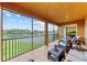 Tranquil screened balcony overlooking lake at 323 Winding Brook Ln # 102, Bradenton, FL 34212