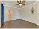 Bright bedroom with dark wood floors and ceiling fan at 135 Sweet Tree St, Bradenton, FL 34212