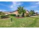 Side view of house showcasing landscaping and lawn at 135 Sweet Tree St, Bradenton, FL 34212