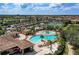 Resort-style pool with surrounding lounge chairs and landscaping at 135 Sweet Tree St, Bradenton, FL 34212