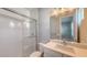 Modern bathroom with white subway tile, quartz vanity, and a glass shower at 21285 Holmes Cir, Venice, FL 34293