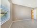 Spacious bedroom with neutral walls, tile floors, and a window with blinds at 21285 Holmes Cir, Venice, FL 34293