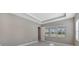 Bedroom with window, neutral walls, and wood-look floors at 21285 Holmes Cir, Venice, FL 34293