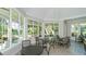Casual dining area with multiple tables and chairs, overlooking the outdoors at 21285 Holmes Cir, Venice, FL 34293