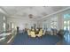 Spacious clubhouse interior with multiple seating areas and large windows at 21285 Holmes Cir, Venice, FL 34293
