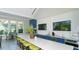 Modern clubhouse kitchen with stainless steel appliances and breakfast bar at 21285 Holmes Cir, Venice, FL 34293