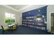 Community clubhouse library with numerous bookshelves and seating at 21285 Holmes Cir, Venice, FL 34293