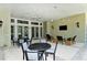 Relaxing community patio with seating areas and tables at 21285 Holmes Cir, Venice, FL 34293