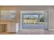 Kitchen with view of backyard patio and trees at 21285 Holmes Cir, Venice, FL 34293