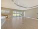 Spacious living room with tile floors and sliding glass doors at 21285 Holmes Cir, Venice, FL 34293