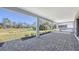 Outdoor kitchen with grill, sink, and cabinetry at 21285 Holmes Cir, Venice, FL 34293