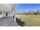 Covered patio overlooking backyard and trees at 21285 Holmes Cir, Venice, FL 34293