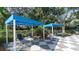 Relaxing pool area with shaded seating and a checkered tile deck at 21285 Holmes Cir, Venice, FL 34293